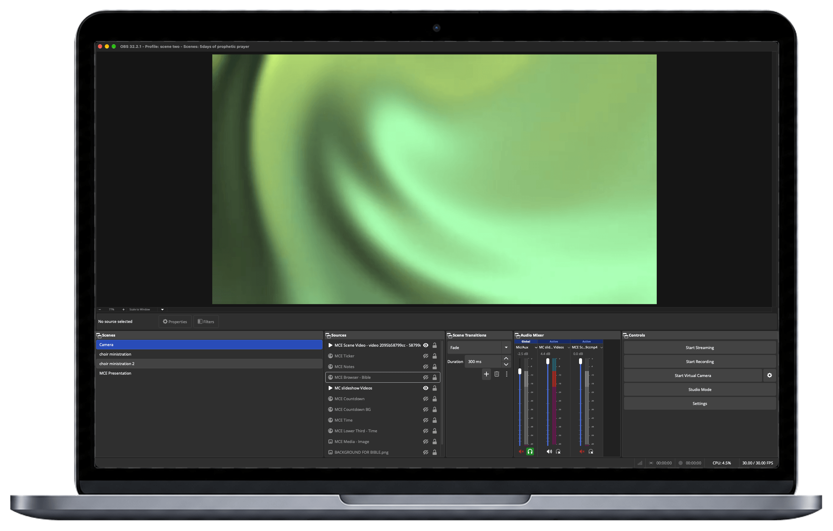 OBS Studio running on a laptop behind the tablet and phone